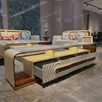 Architectural TV Stand with Sculpted Relief Panels Natural Wood Veneer Open Display Shelves and Soft Ambient Lighting